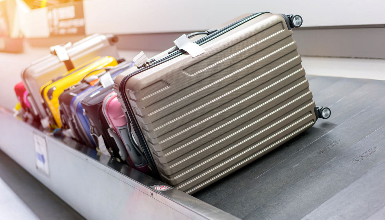 Suitcase or luggage with conveyor belt in the airport