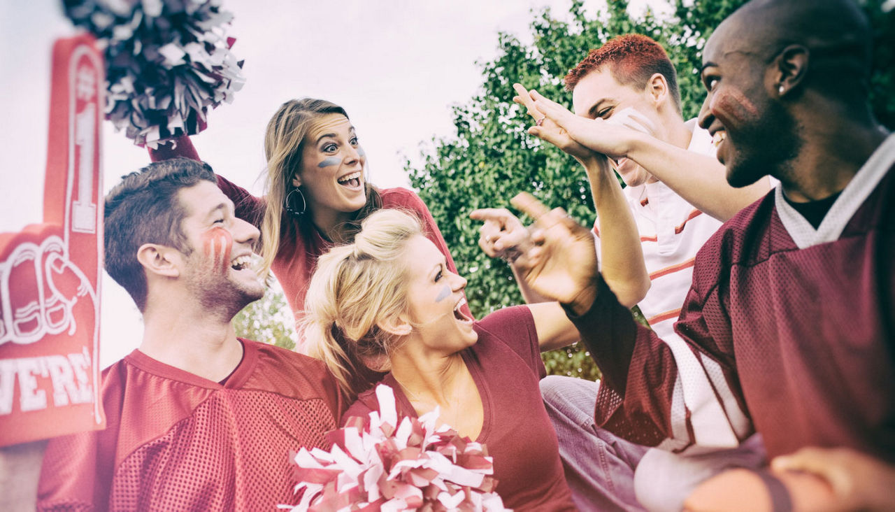 Tailgating: Group Of College Students Excited For Football Game