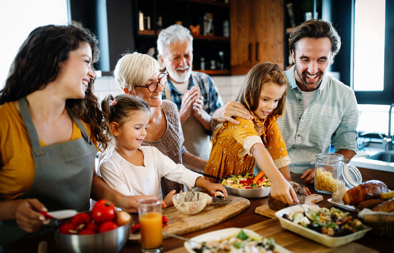 Portrait of happy family in kitchen at home