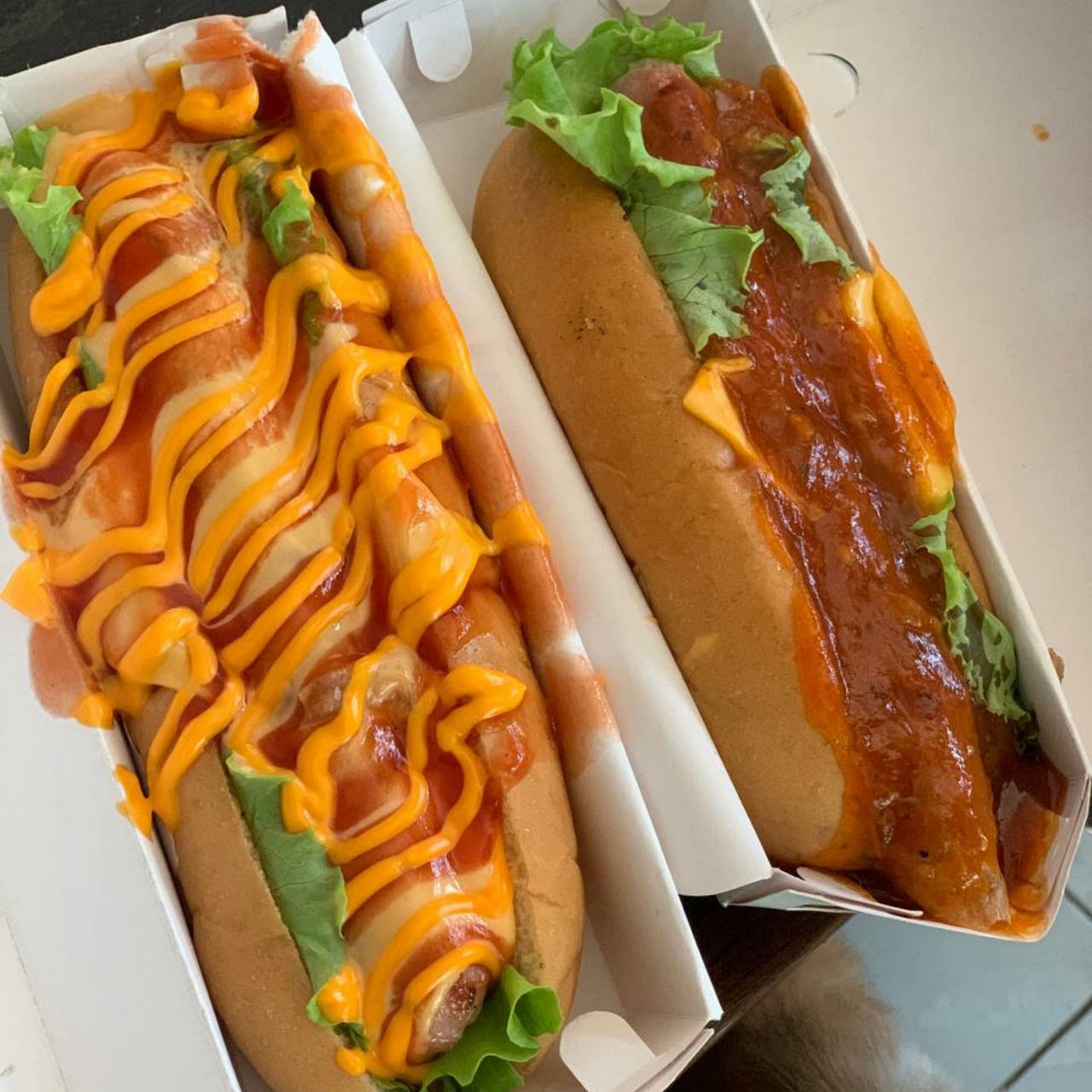 Specialty hot dogs at a baseball concession