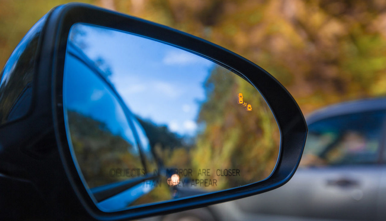 Close-up of a side car mirror