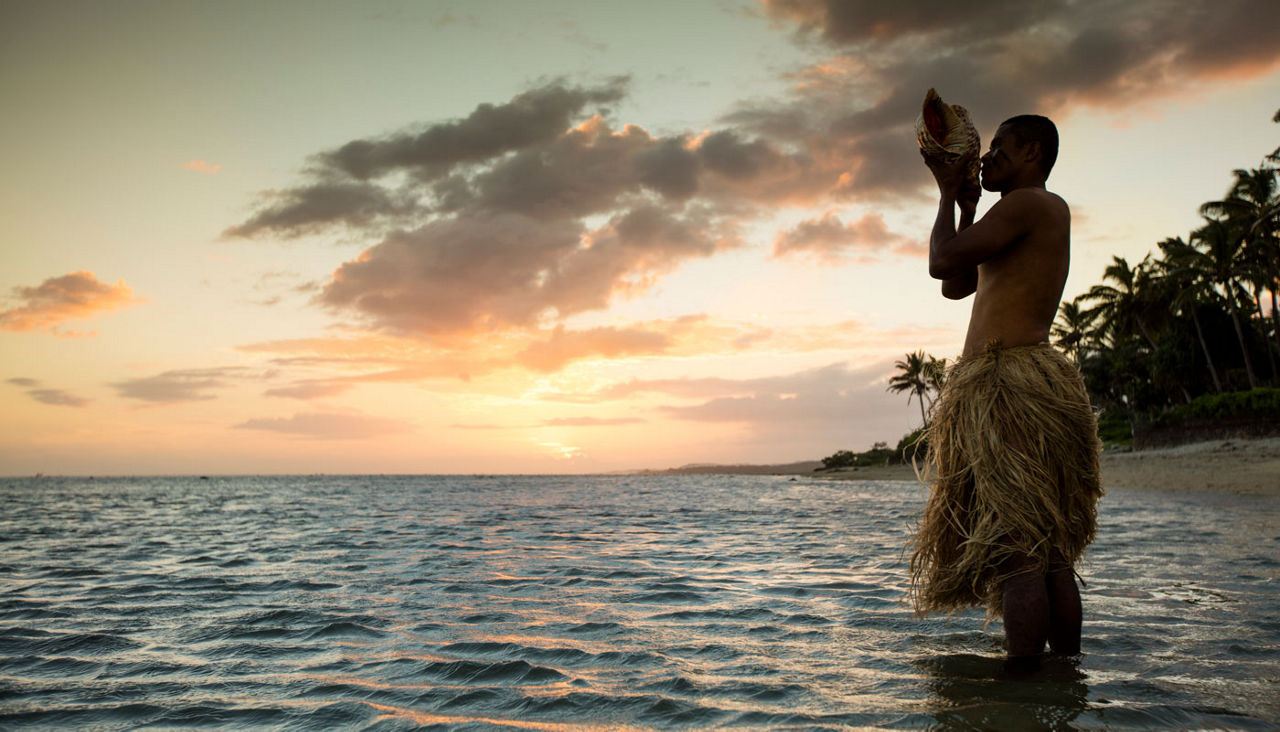 A sunset ceremony at the Outrigger Fiji Beach Resort