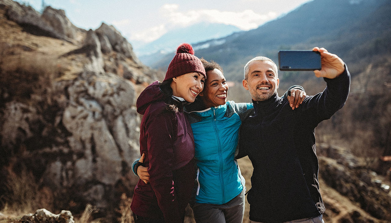 Group of hikers making memories on new adventure