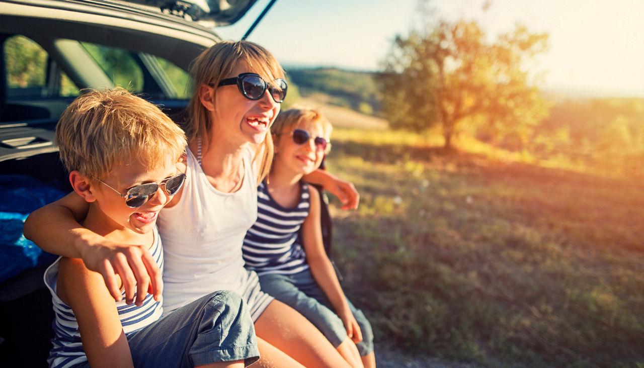 Family resting on a road trip