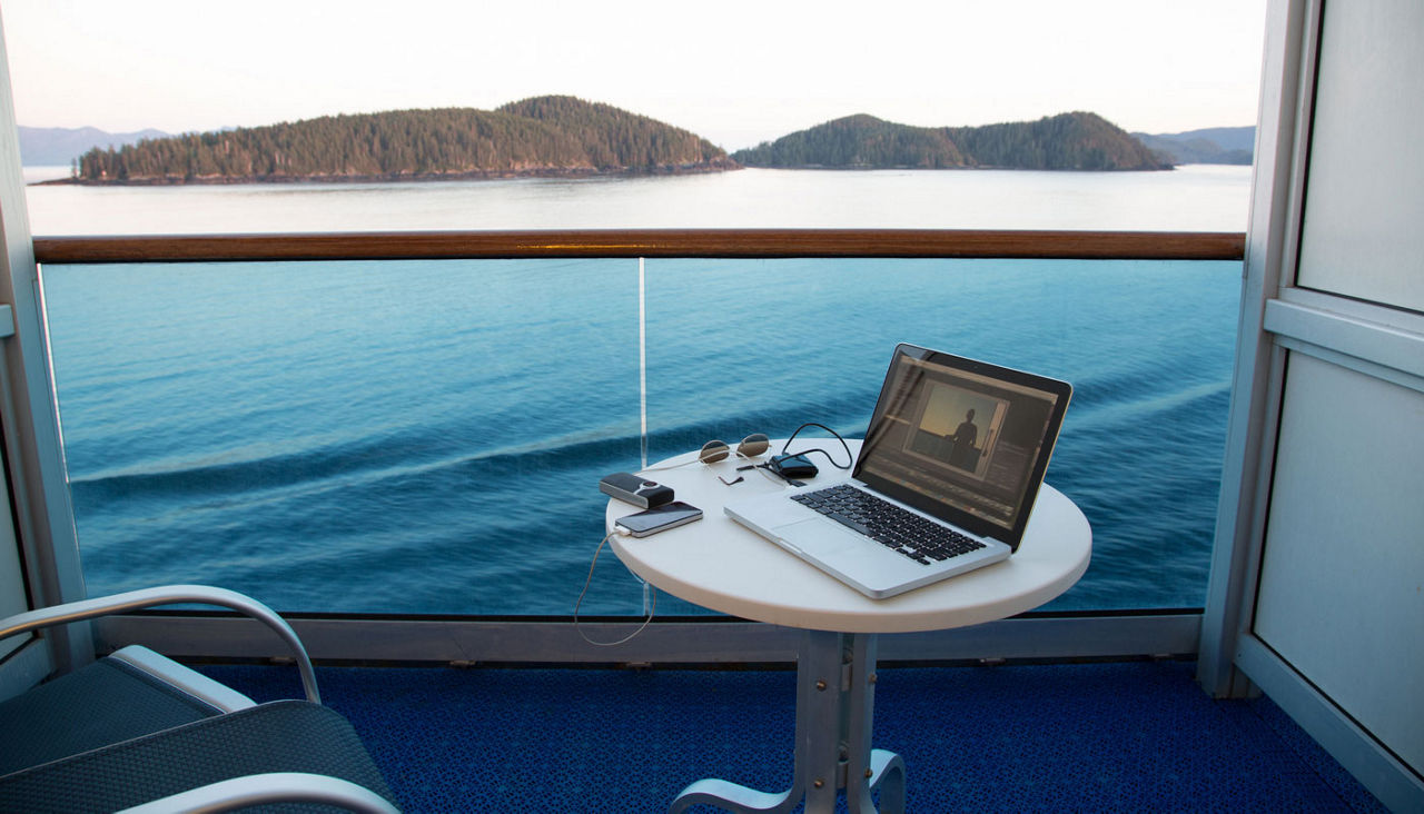 View from cruise ship with laptop on table, Alaska