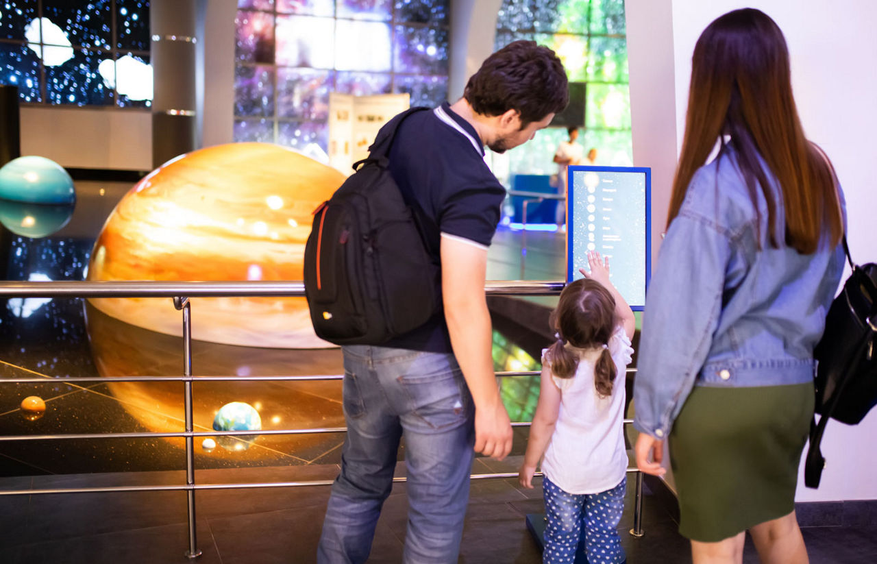 family at a planetarium