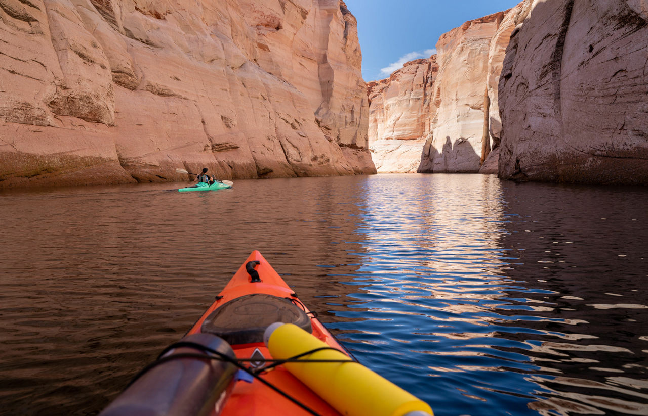 Orange kayak floating on Lake Powell near Antelope Canyon in Arizona