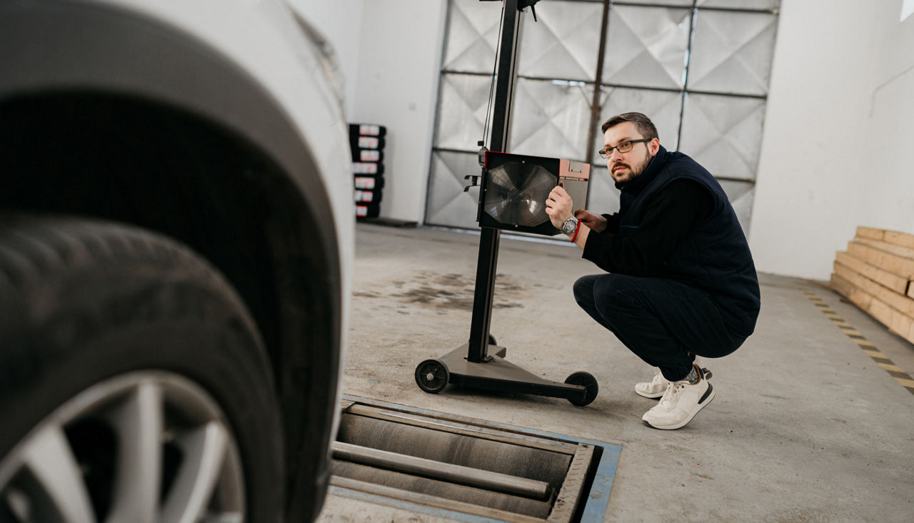 Light calibrating machine in car preparing the vehicle for technical inspection