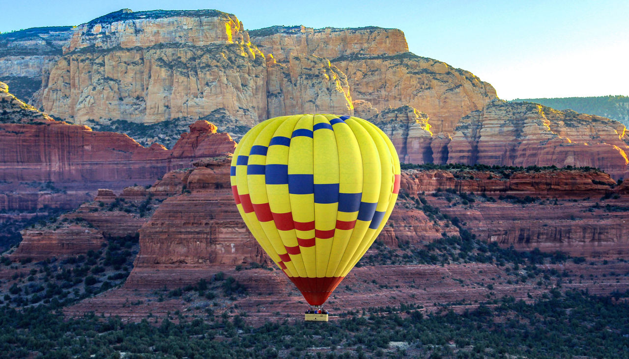 Hot air balloon against mountain, Sedona, Arizona