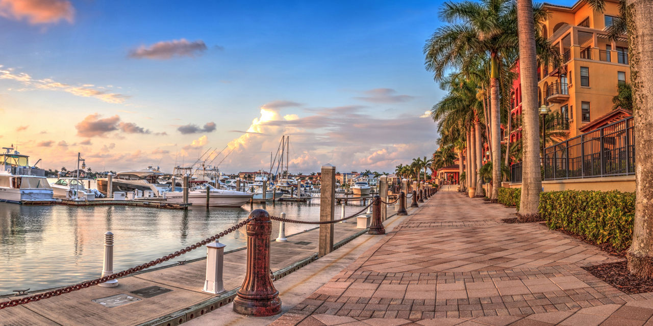 Sunset over the boats in Esplanade Harbor Marina in Marco Island
