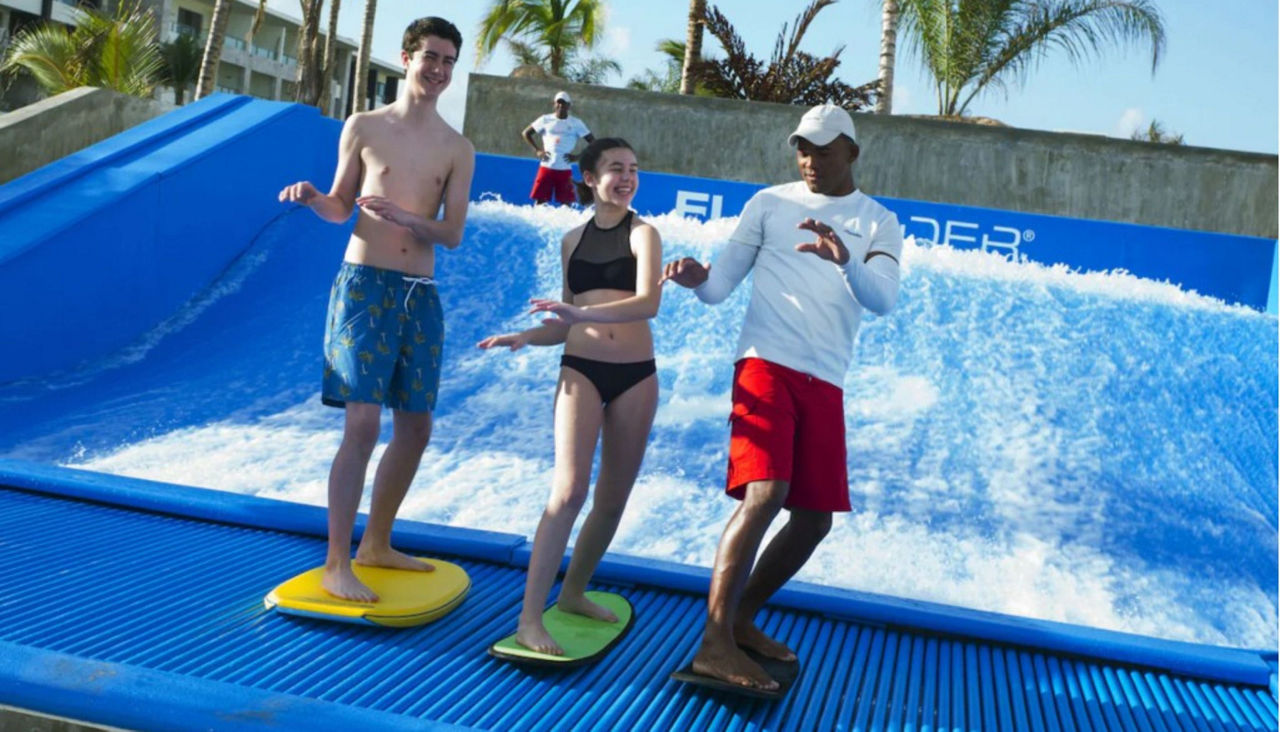 Two teens learning to surf at Royalton Bavaro Resort