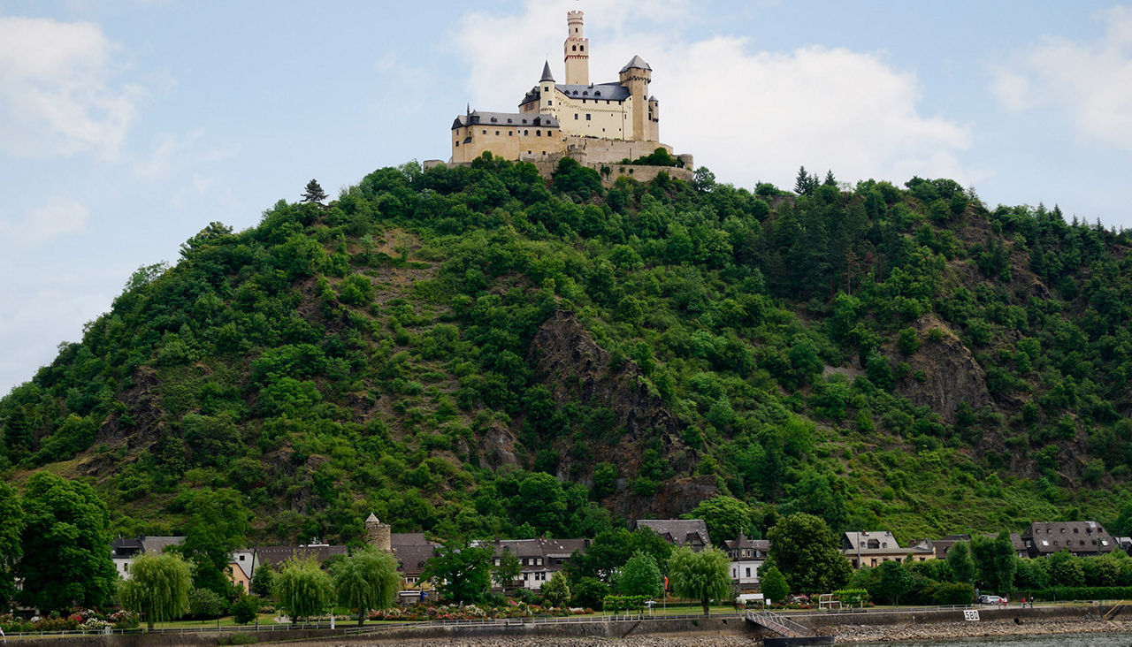 Marksburg Castle on top of hill overlooking village of Braubach