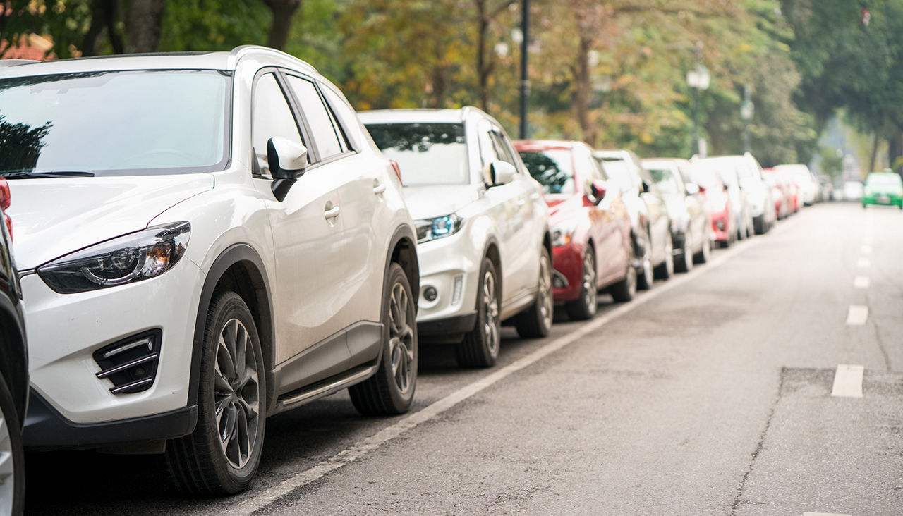 Cars parked on the urban street side