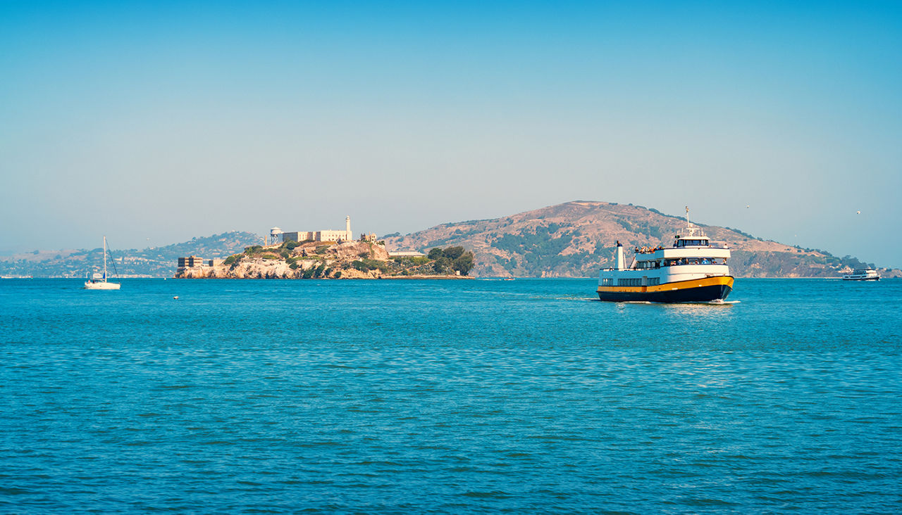 Stock photograph of a ferry with visitors coming from Alcatraz Island in San Francisco, California, USA on a sunny day.