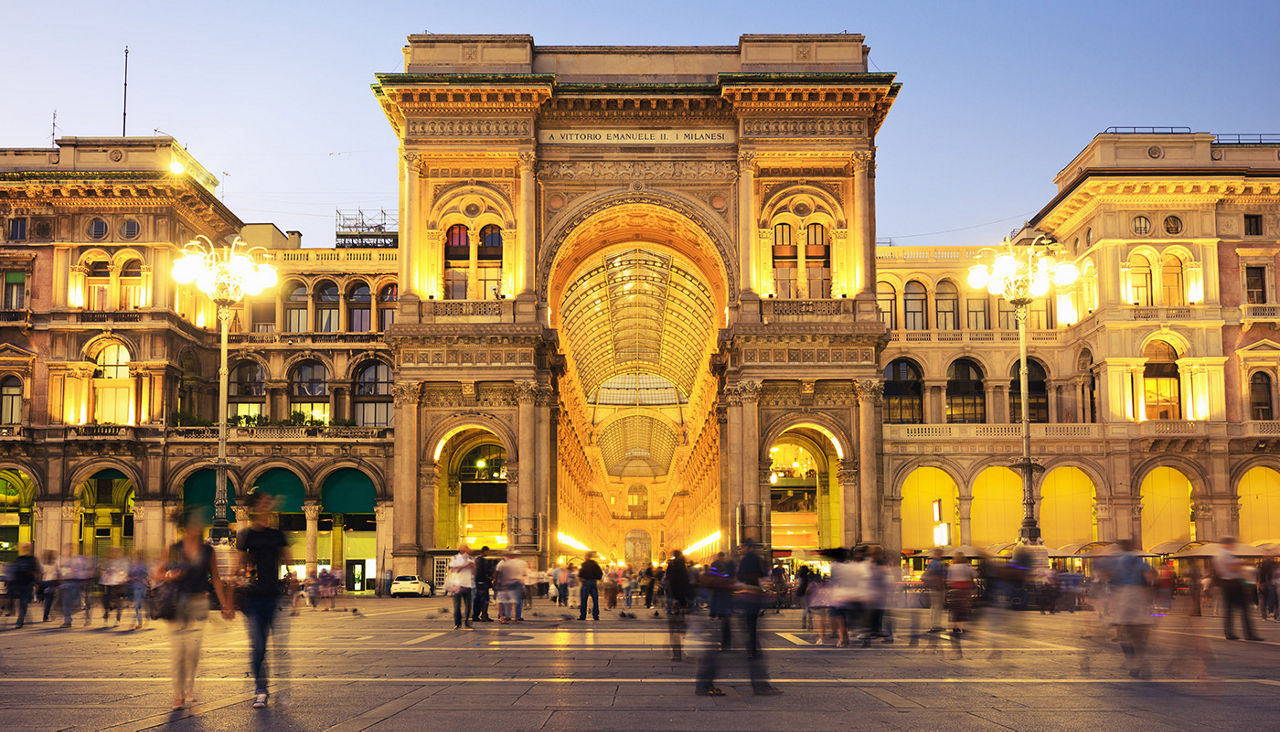 A night-time view of a large building in Milan.