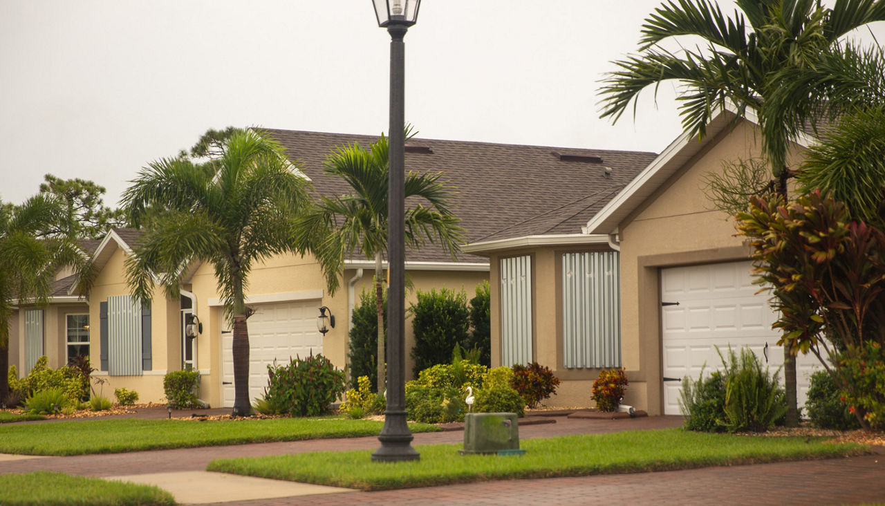Home prepared for a hurricane with window shutters