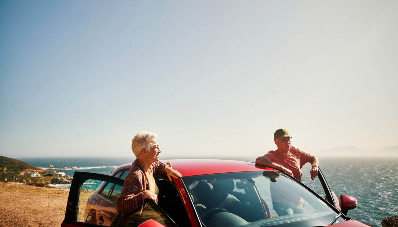 Shot of a couple stopping to admire the view during a road trip along the coast