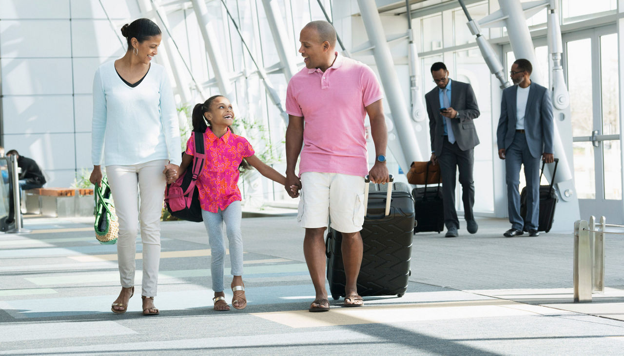 Family in airport going on spring break vacation