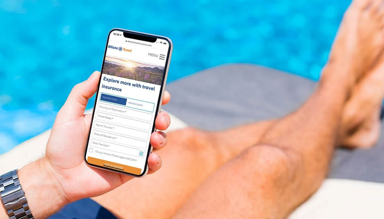 Man holding smartphone with Allianz information on screen