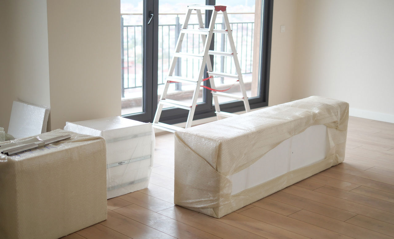 New Home With Furniture Still Wrapped and Ready for Setup
