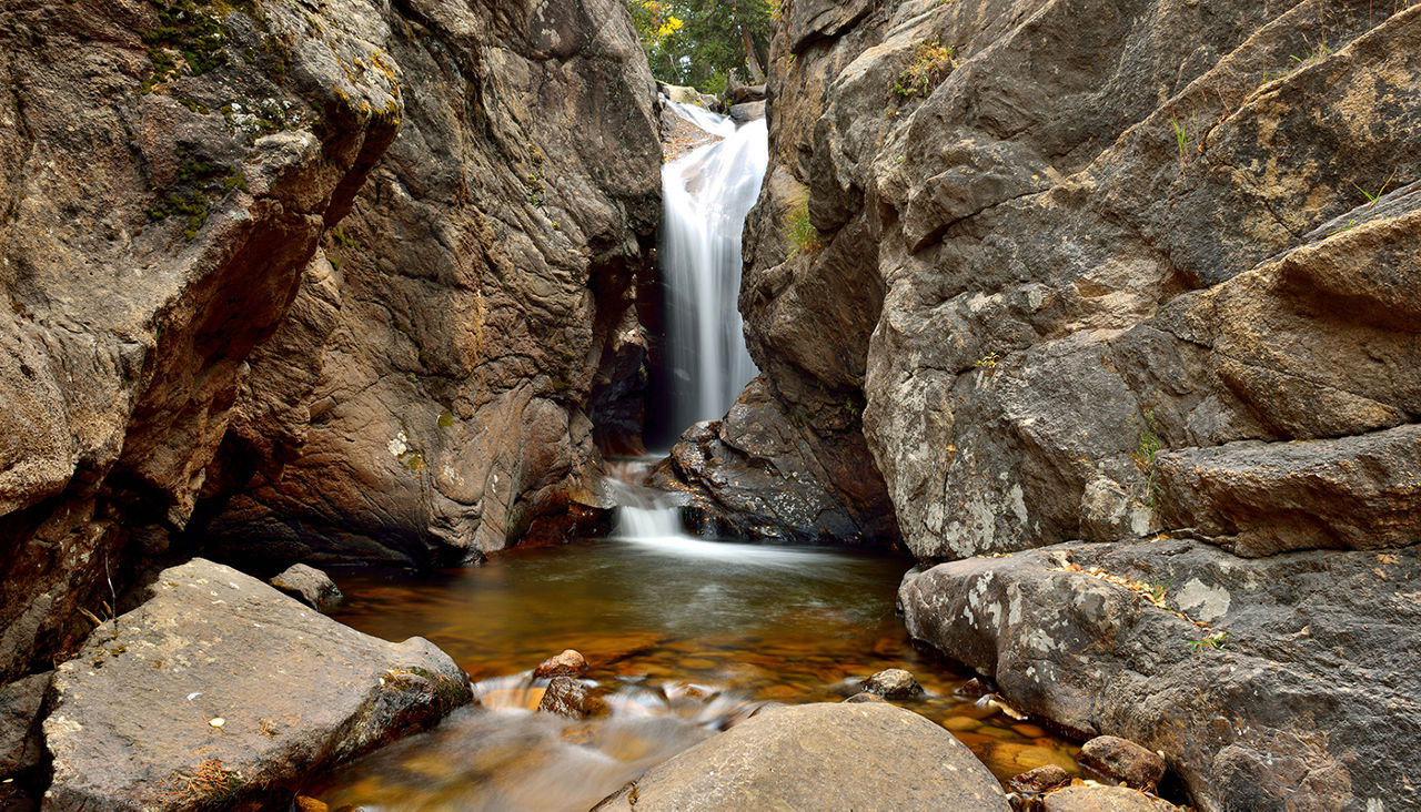 Close-up autumn view of Chasm Falls, on Old Fall River Road, in Rocky Mountain National Park. 