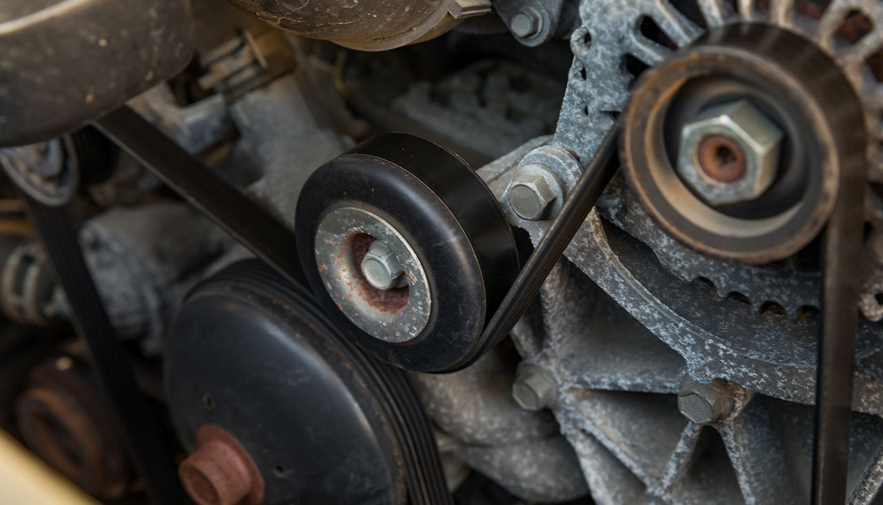 A close-up of a vehicle’s serpentine belts.