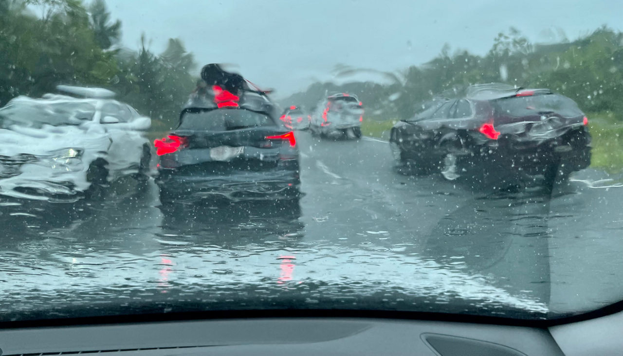 Cars trapped on the highway during high wind and rain.