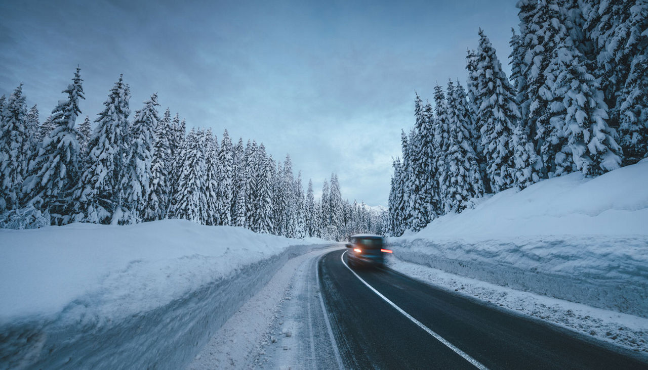 Driving on a snow covered mountain road.