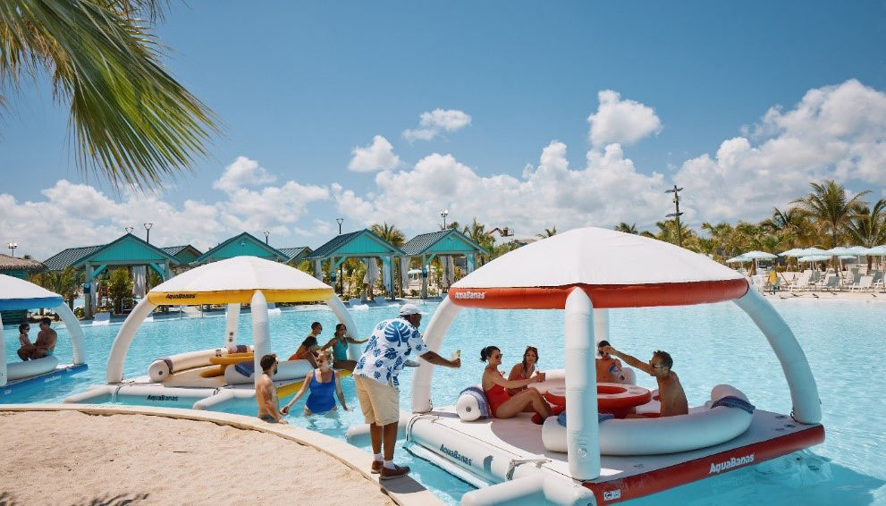 Poolside cabanas with floating lounge pods on Celebration Key