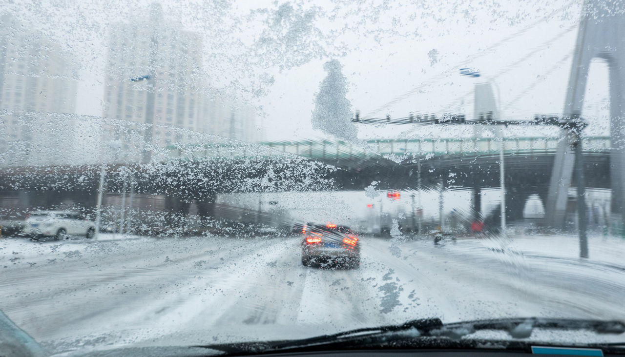 cars driving in rain or snow
