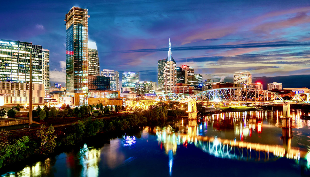The city of Nashville Tennessee cityscape on the Cumberland River at night