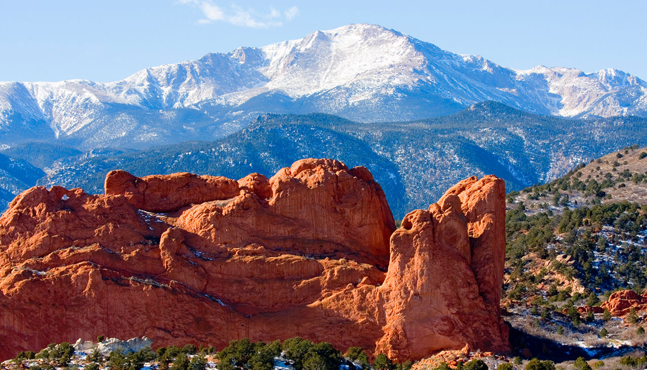 Snow covered Garden of the Gods Park in Colorado Springs at the base of 14000 foot Pikes Peak in the wintertime.