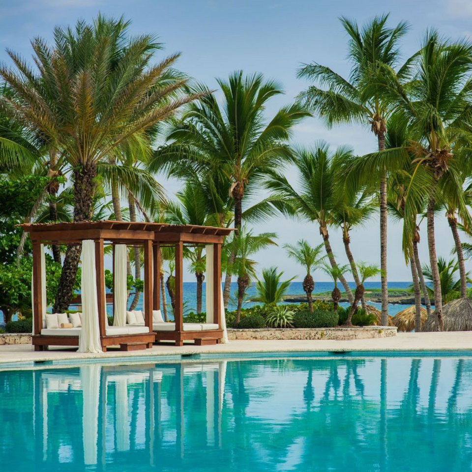 AAA Hotels swimming pool with luxurious cabanas in the Dominican Republic