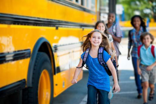 Group of kids getting off a school bus