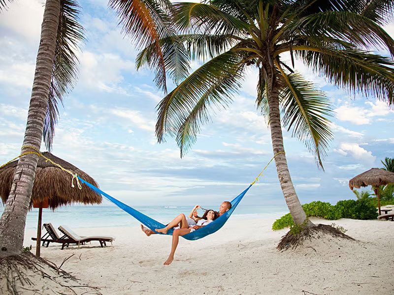 Couple in a hammock on a tropical beach