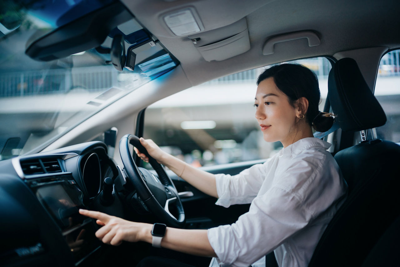 A woman in a car.