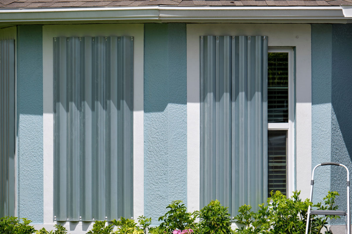 A house with hurricane shutters over the windows.
