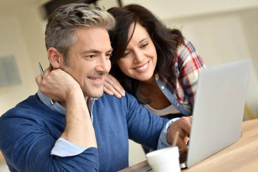 Couple Monitoring Their Credit Online