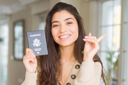 Young woman holding a passport