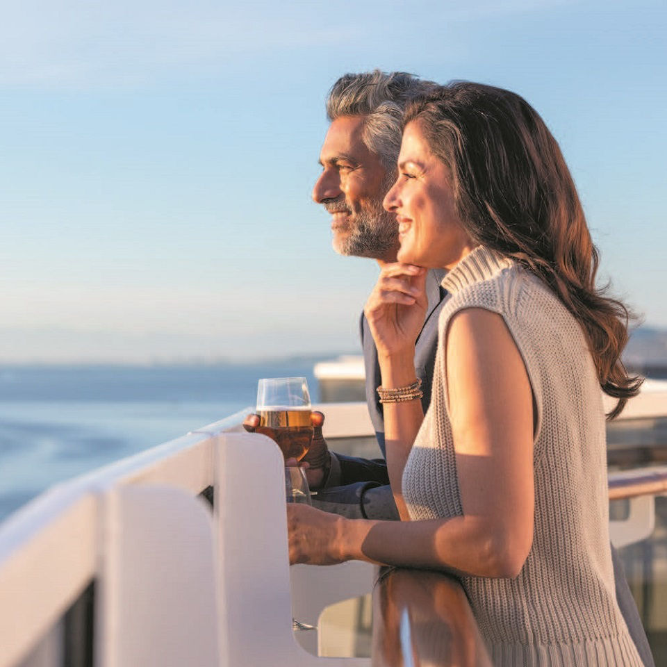 Happy couple on deck aboard Regent Seven Seas Cruises