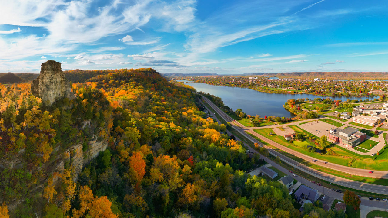 An aerial view of Winona, Minnesota. A lake in the distance.