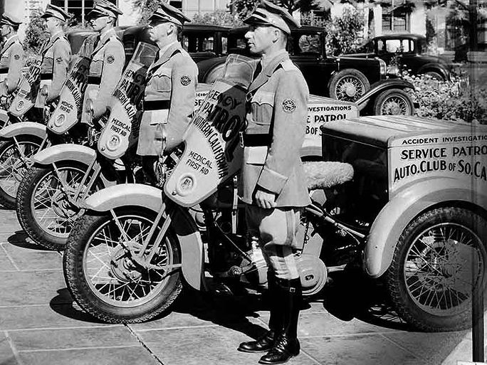 AAA service patrol men in the 1900s lined up on the street