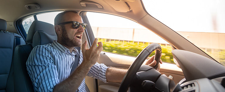Aggressive and crazy driver in his car