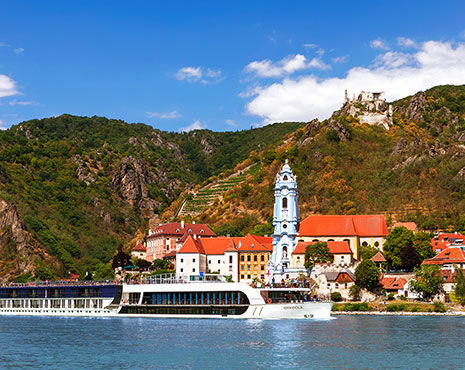 AmaWaterways river cruise in Europe passing old-world architecture on land