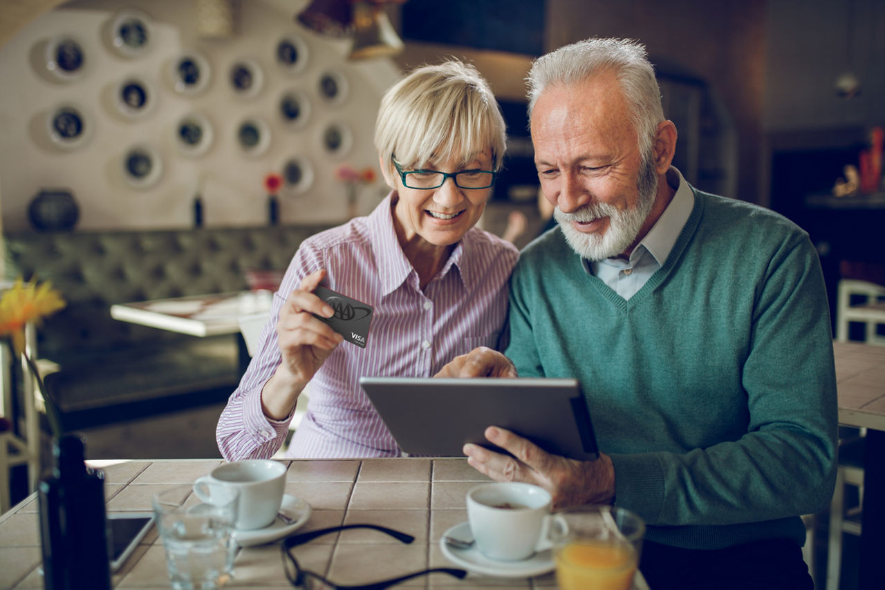 older couple purchasing on tablet