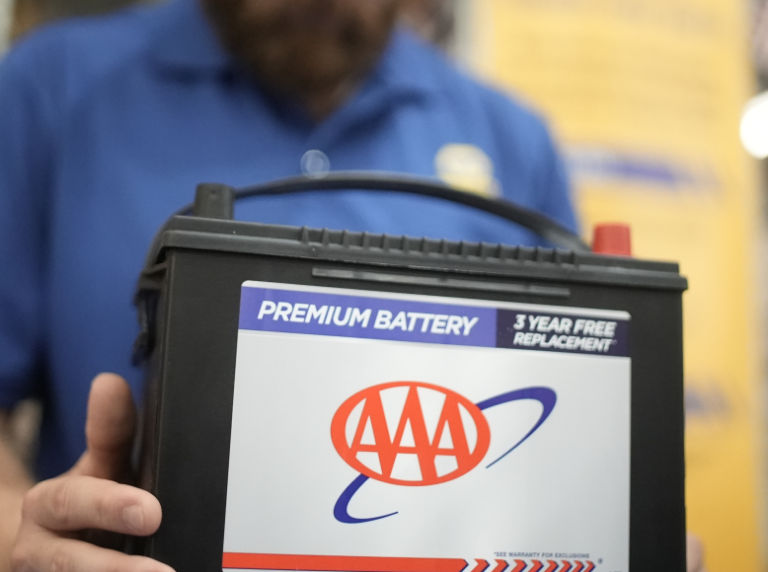 Man holding car battery