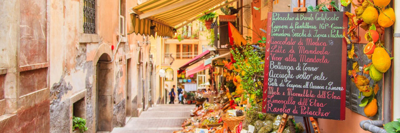 Italian Street with flowers and a cafe sign