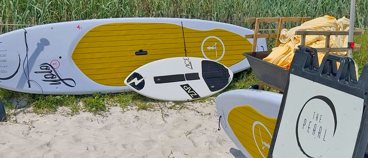 SUP boards propped on the sand