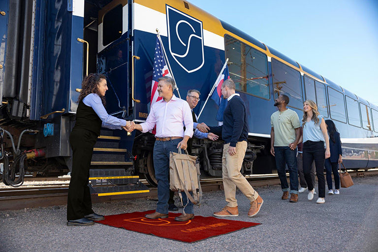 Guests welcomed in style on the red carpet before boarding the Canyon Spirit train.