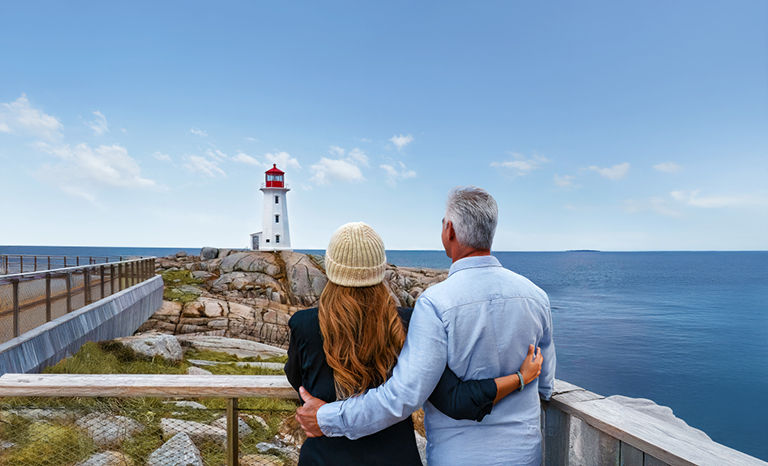 A couple looking at the Peggy's Cove Lighthouse in Canada